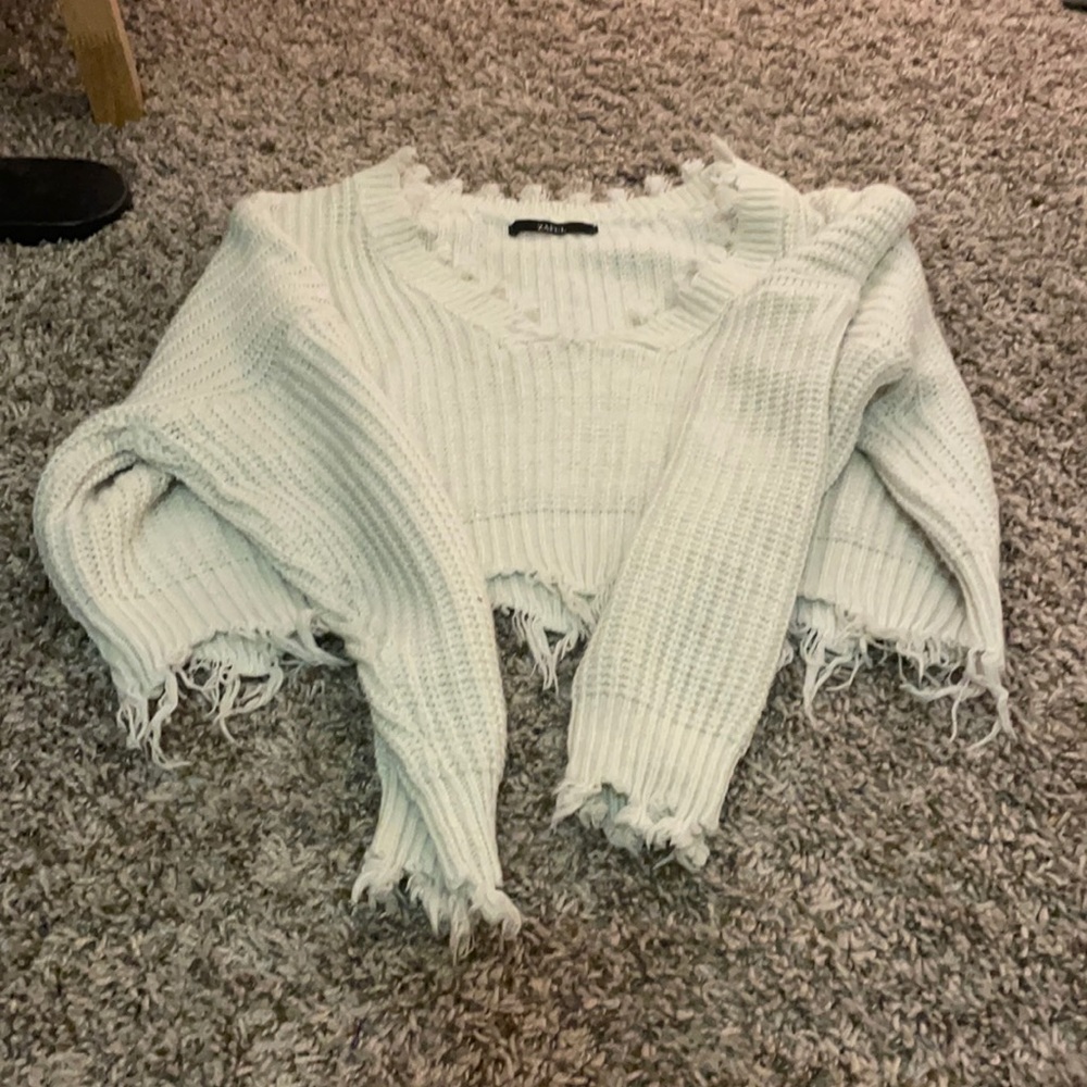 white fringed sweater